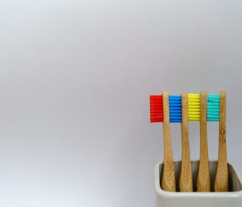 4 colorful toothbrushes
