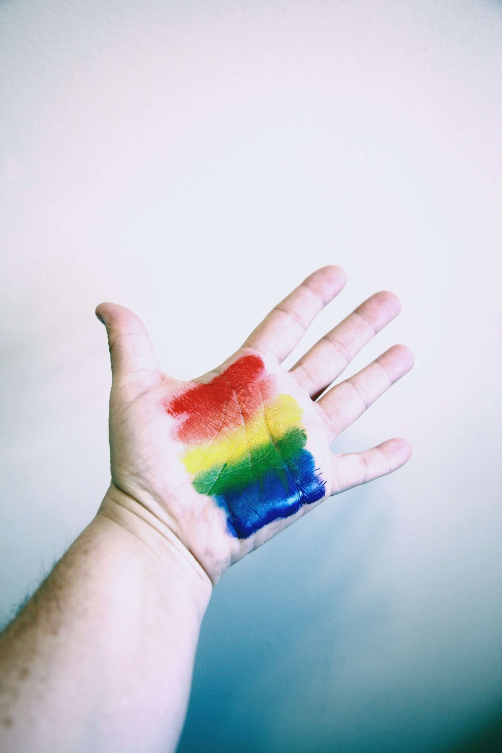 hand with rainbow paint